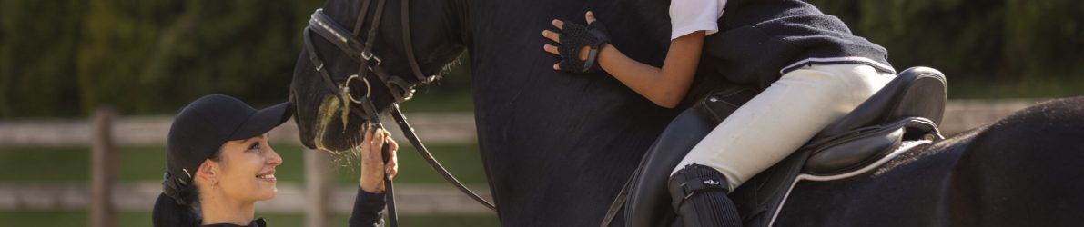 side-view-girl-learning-ride-horse